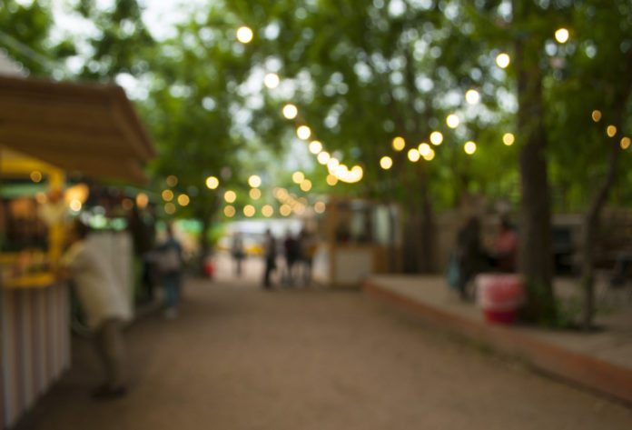 Abstract blur festival in the city park bokeh background.