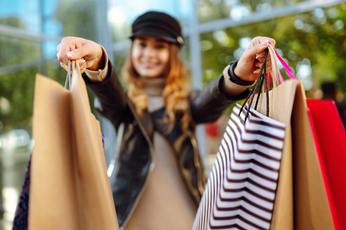 Shopping bags in the woman hands. Fashion woman with shopping ba