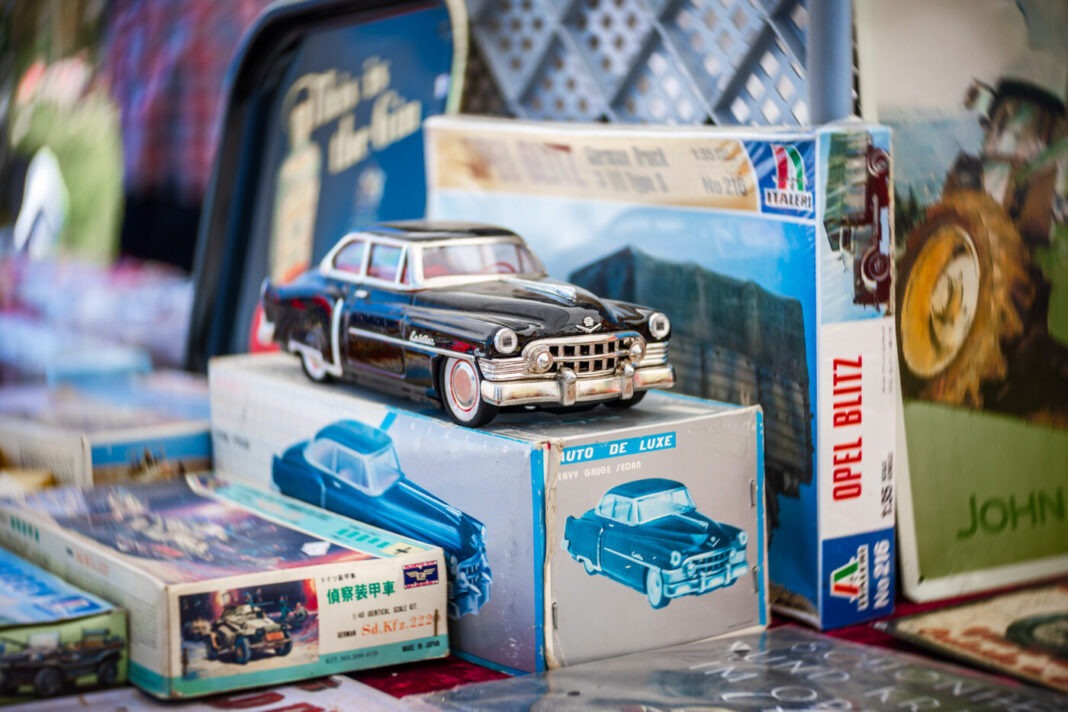 LINTHE, GERMANY - MAY 27, 2023: Cadillac toy car. Flea market at the exhibition. Art lens. Swirl bokeh. Die Oldtimer Show 2023. Stöbermeile in Husum